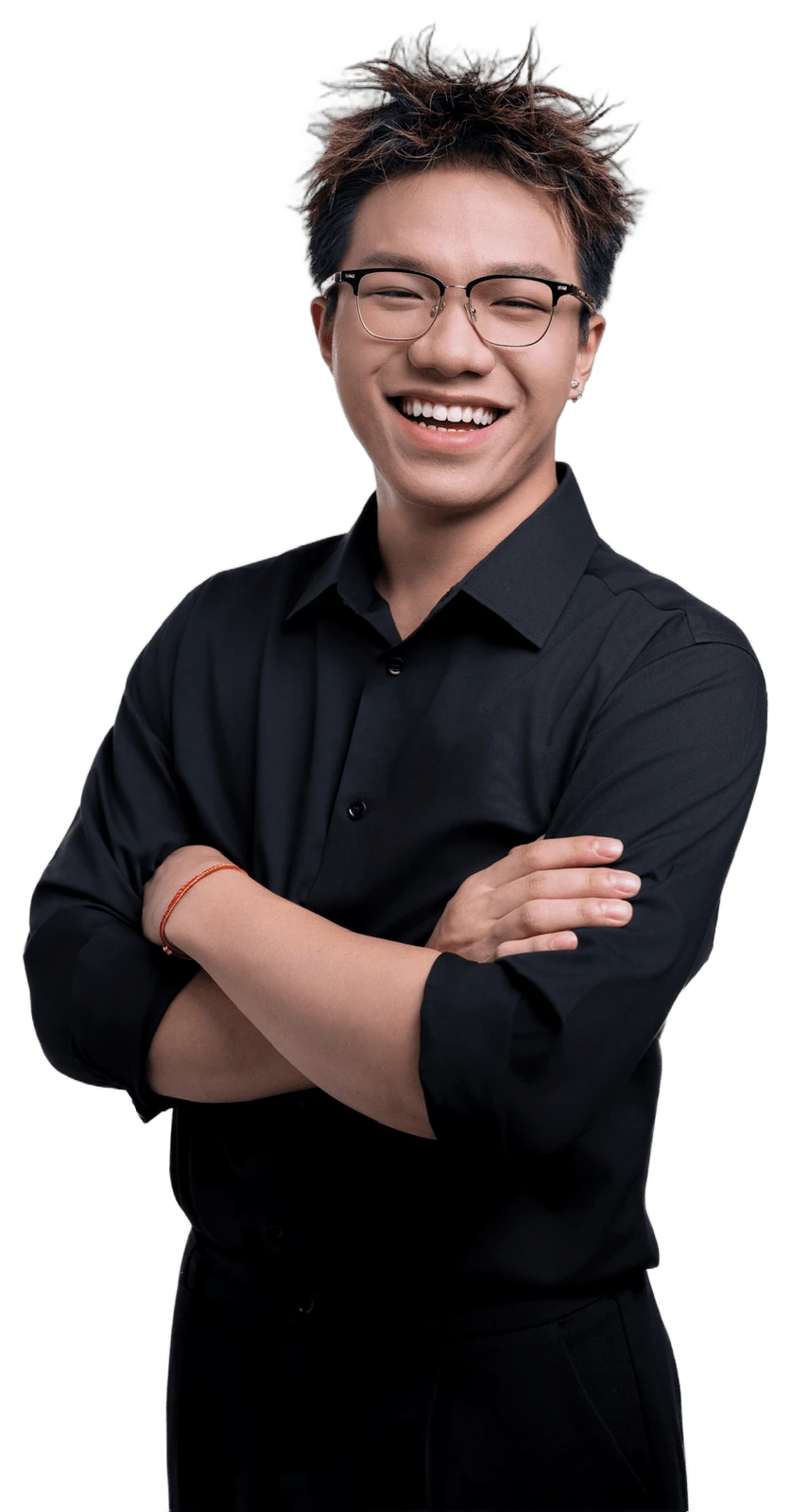 Austin Zhang, arms folded and laughing, cut out from the studio ground.